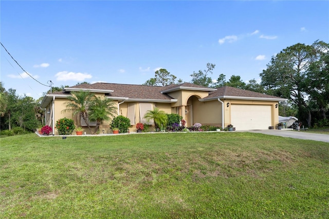 mediterranean / spanish house featuring driveway, a front lawn, stucco siding, and an attached garage