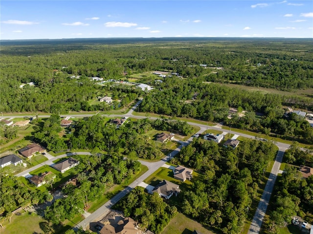 bird's eye view with a residential view and a view of trees