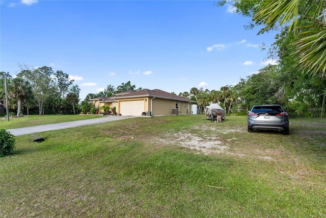 view of front of house featuring stucco siding, concrete driveway, a front lawn, and a garage