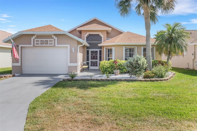 3640 Gloxinia Dr, North Fort Myers, FL 33917 - view of front of house with an attached garage, a front lawn, driveway, and stucco siding