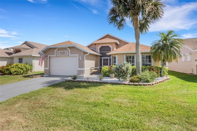 3640 Gloxinia Dr, North Fort Myers, FL 33917 - view of front of property featuring a front lawn, driveway, an attached garage, and stucco siding