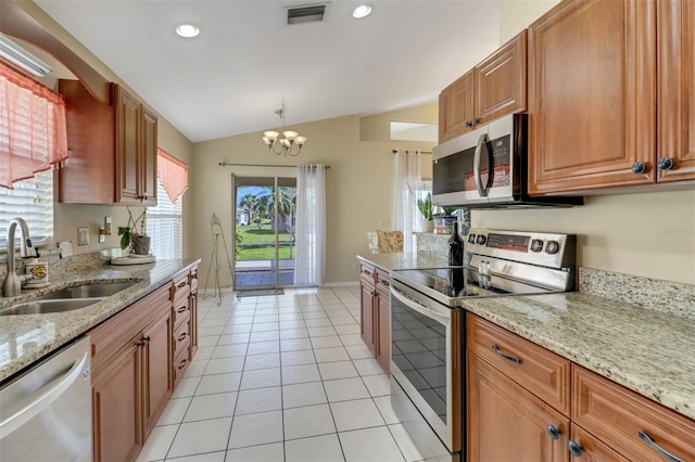 3640 Gloxinia Dr, North Fort Myers, FL 33917 - kitchen with appliances with stainless steel finishes, a sink, visible vents, a notable chandelier, and lofted ceiling