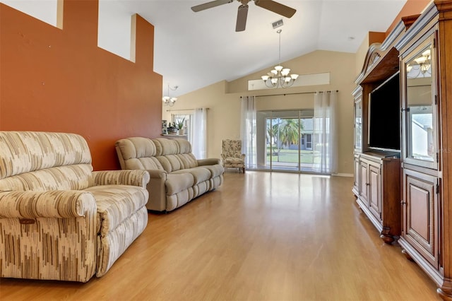 3640 Gloxinia Dr, North Fort Myers, FL 33917 - living room with high vaulted ceiling, ceiling fan with notable chandelier, and light wood finished floors