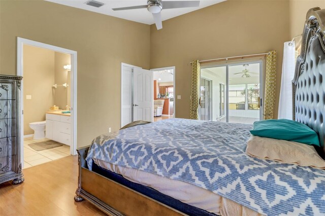 3640 Gloxinia Dr, North Fort Myers, FL 33917 - bedroom featuring wood finished floors, access to exterior, ensuite bathroom, visible vents, and a ceiling fan