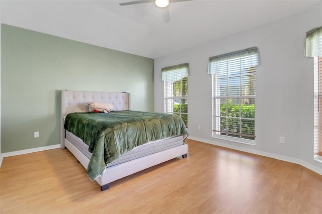 3640 Gloxinia Dr, North Fort Myers, FL 33917 - bedroom with wood finished floors, a ceiling fan, and baseboards