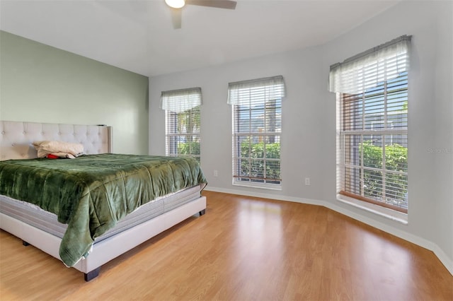 3640 Gloxinia Dr, North Fort Myers, FL 33917 - bedroom with wood finished floors, a ceiling fan, and baseboards