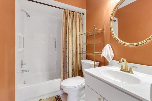 3640 Gloxinia Dr, North Fort Myers, FL 33917 - full bathroom featuring toilet, shower / bath combo with shower curtain, and vanity