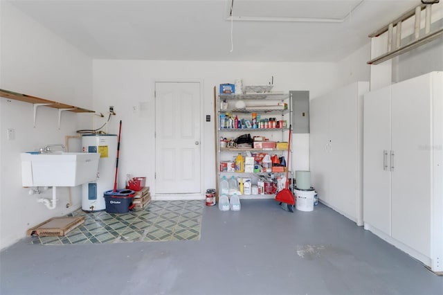 3640 Gloxinia Dr, North Fort Myers, FL 33917 - garage featuring water heater, electric panel, and a sink