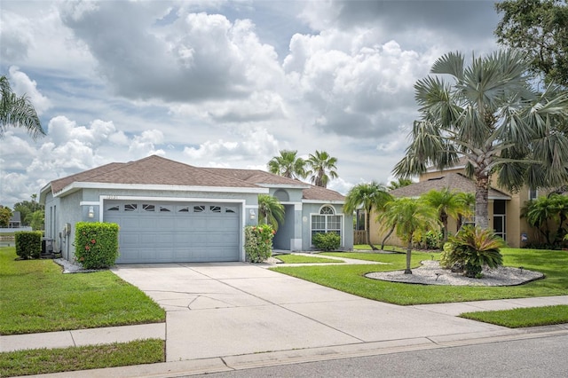 12026 Warwick Cir, Parrish, FL 34219 - ranch-style house featuring stucco siding, a front lawn, a garage, and driveway