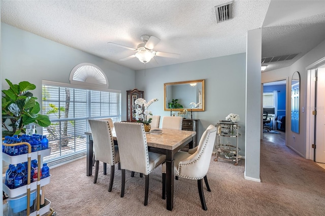 12026 Warwick Cir, Parrish, FL 34219 - carpeted dining room with ceiling fan and a textured ceiling