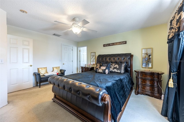 12026 Warwick Cir, Parrish, FL 34219 - bedroom with light carpet, a ceiling fan, and a textured ceiling