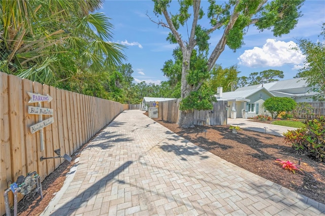 2537 Ashton Rd, Sarasota, FL 34231 - view of street with driveway and a gate