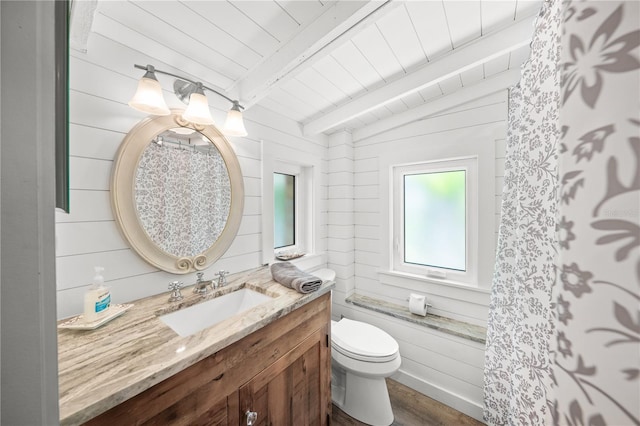 2537 Ashton Rd, Sarasota, FL 34231 - bathroom with lofted ceiling with beams, wooden ceiling, toilet, wood finished floors, and vanity
