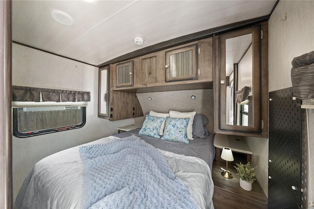 2537 Ashton Rd, Sarasota, FL 34231 - bedroom featuring wood finished floors and vaulted ceiling