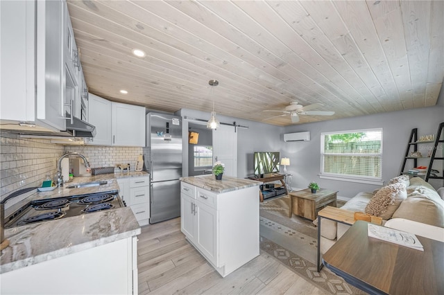 2537 Ashton Rd, Sarasota, FL 34231 - kitchen with wood ceiling, stainless steel fridge, a sink, a wall unit AC, and a ceiling fan