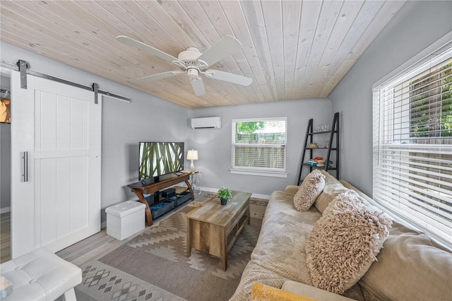 2537 Ashton Rd, Sarasota, FL 34231 - living room featuring a wall mounted AC, a barn door, ceiling fan, wood ceiling, and wood finished floors
