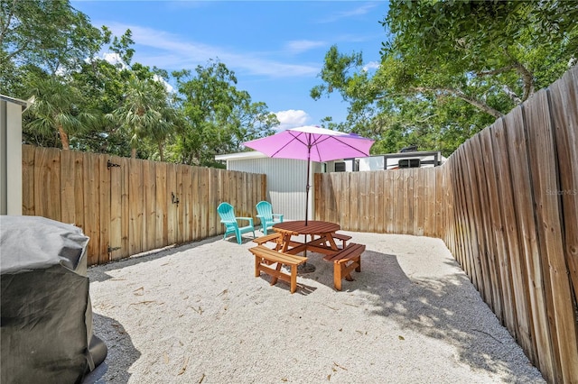 2537 Ashton Rd, Sarasota, FL 34231 - view of yard featuring a patio area, outdoor dining area, and a fenced backyard