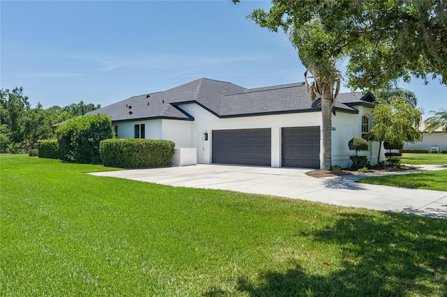 3806 155th Ave E, Parrish, FL 34219 - view of front of home with an attached garage, stucco siding, a front lawn, and concrete driveway