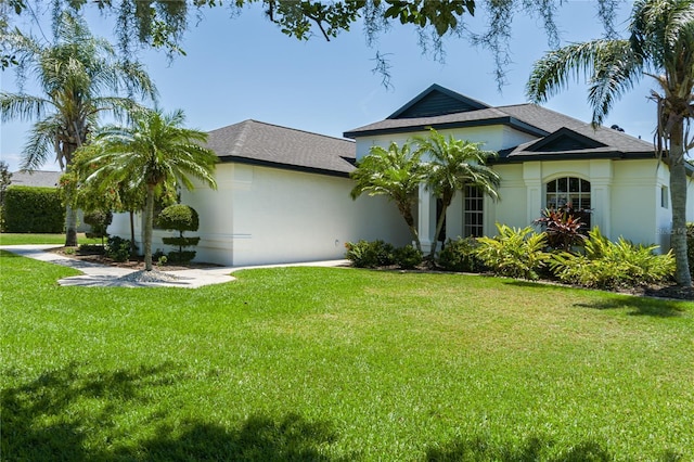 3806 155th Ave E, Parrish, FL 34219 - single story home with a front yard, stucco siding, and roof with shingles
