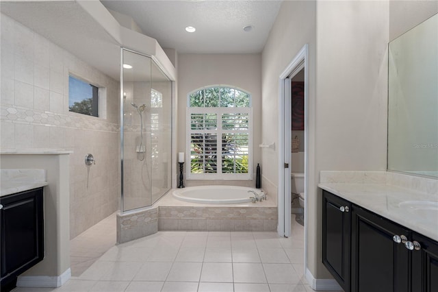 3806 155th Ave E, Parrish, FL 34219 - full bathroom with vanity, a garden tub, a walk in shower, tile patterned flooring, and a fireplace