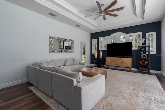 3806 155th Ave E, Parrish, FL 34219 - living room with a tray ceiling, a ceiling fan, dark wood-style floors, and ornamental molding