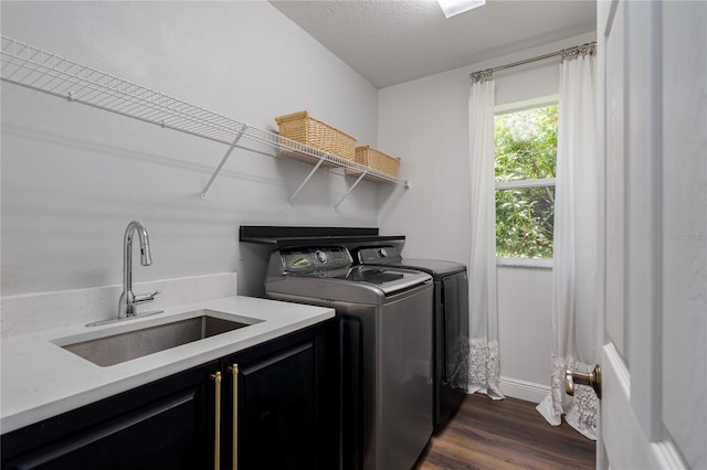 3806 155th Ave E, Parrish, FL 34219 - washroom with cabinet space, washer and clothes dryer, and dark wood-type flooring