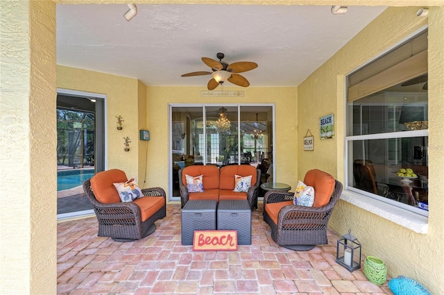 view of patio featuring ceiling fan and an outdoor living space
