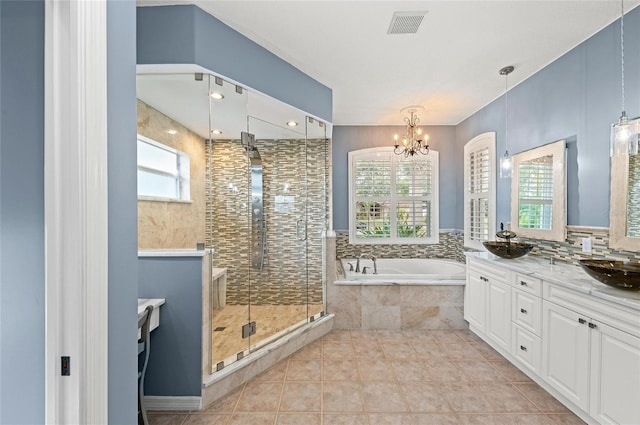 full bath with vanity, a shower stall, a bath, and visible vents