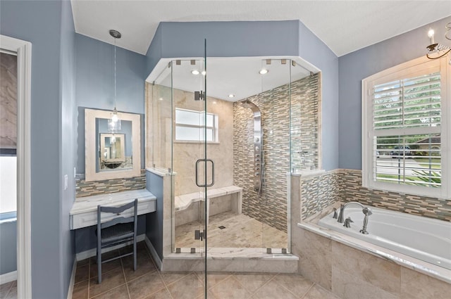 full bath featuring tile patterned flooring, a shower stall, and a bath