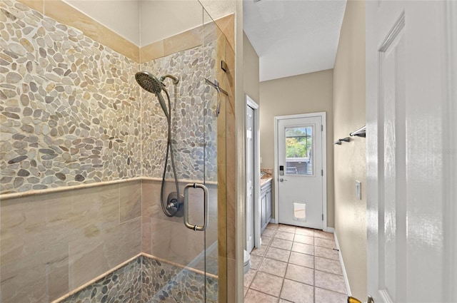 bathroom with vanity and a shower stall