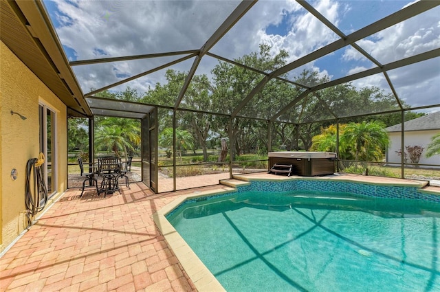pool featuring a lanai, a patio, a hot tub, and outdoor dining space