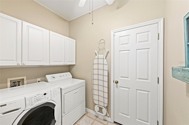 clothes washing area with a ceiling fan, independent washer and dryer, cabinet space, light tile patterned floors, and baseboards