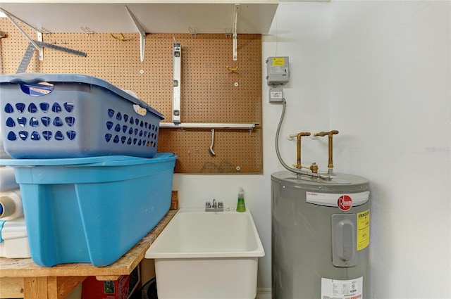 utility room featuring a sink and water heater