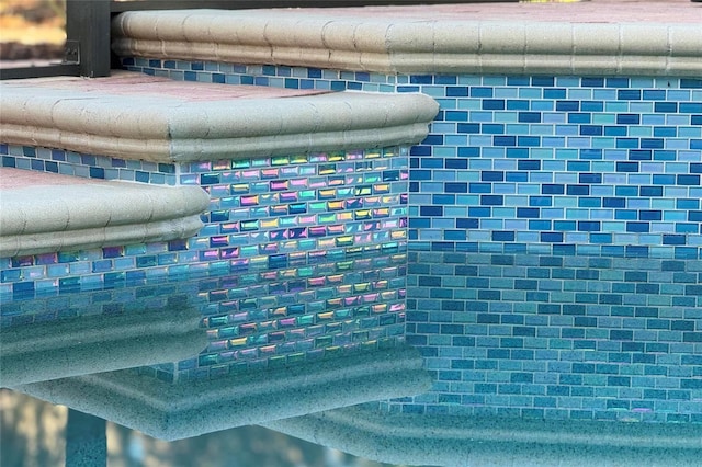 interior details featuring decorative backsplash