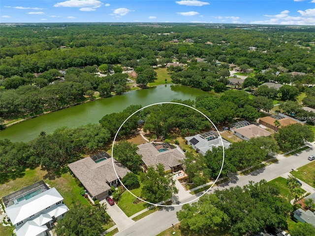 aerial view with a water view, a residential view, and a forest view