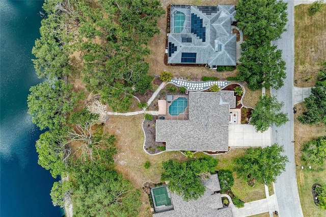 birds eye view of property with a water view