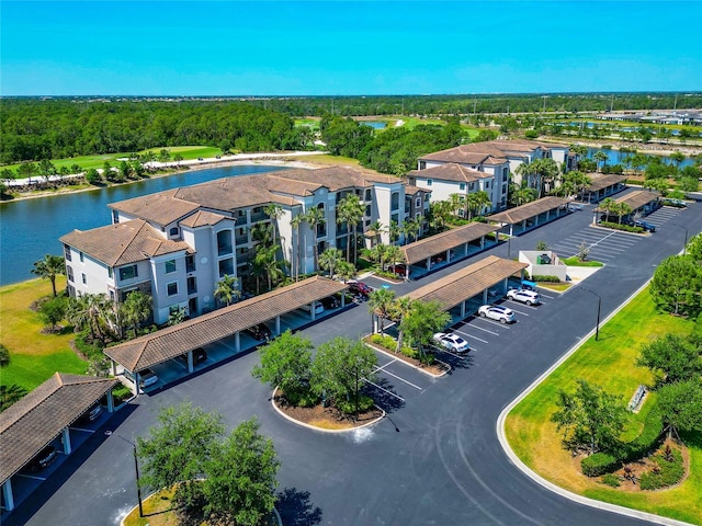 birds eye view of property with a water view