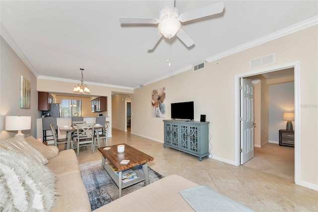 living area featuring visible vents, arched walkways, light tile patterned flooring, and crown molding