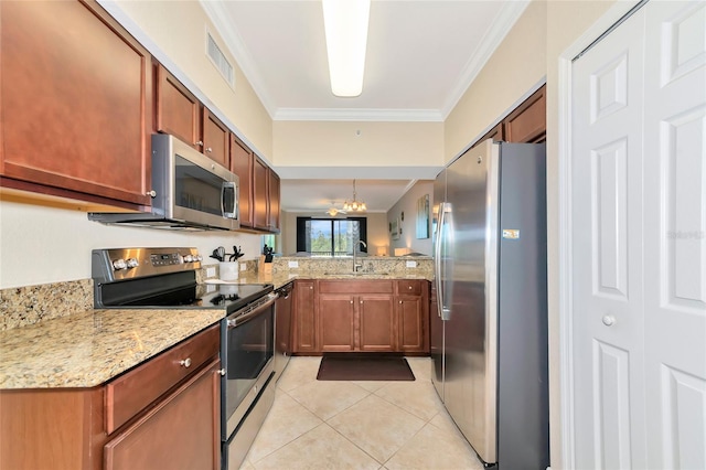 kitchen featuring light stone counters, stainless steel appliances, ornamental molding, a sink, and visible vents