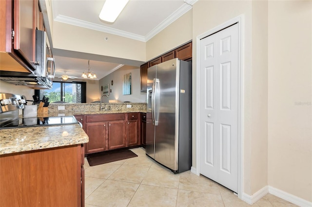 kitchen featuring light stone counters, light tile patterned floors, stainless steel appliances, and crown molding