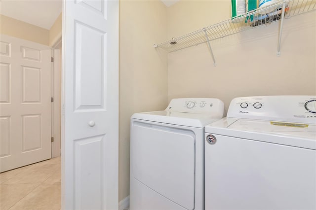 laundry area with light tile patterned floors, laundry area, and independent washer and dryer