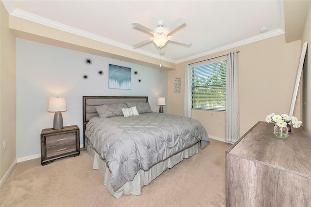 bedroom featuring baseboards, ornamental molding, a ceiling fan, and light carpet