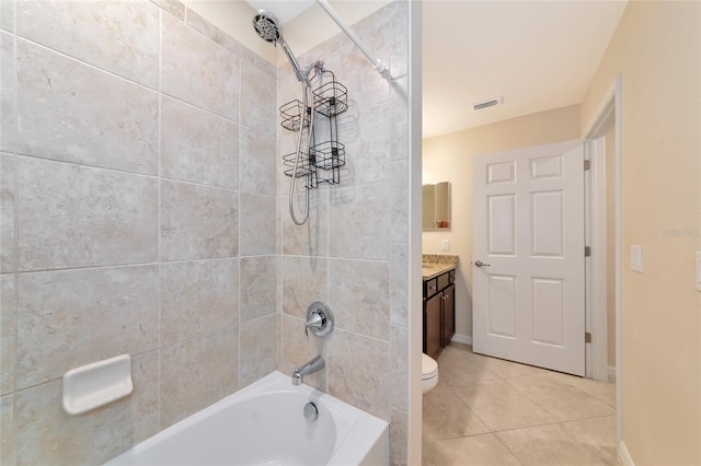 full bath with tile patterned floors, vanity, baseboards, visible vents, and tub / shower combination