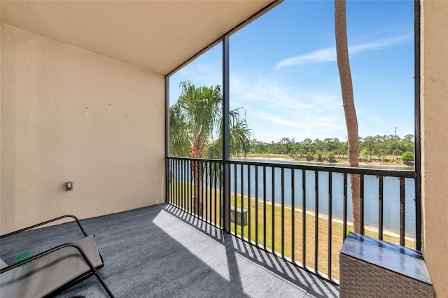 balcony featuring a water view