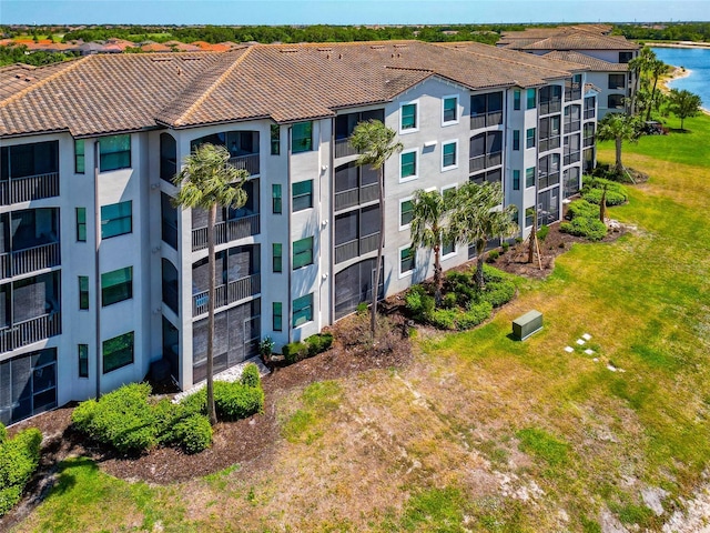 view of building exterior with a water view