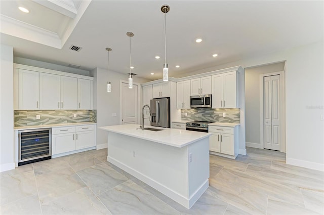 kitchen featuring recessed lighting, tasteful backsplash, appliances with stainless steel finishes, and beverage cooler