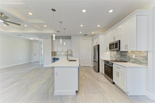 kitchen featuring recessed lighting, a kitchen island with sink, a sink, stainless steel appliances, and light countertops