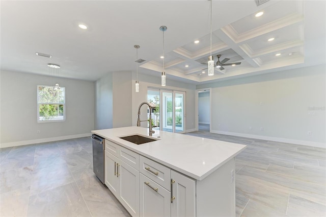 kitchen with stainless steel dishwasher, plenty of natural light, open floor plan, and a sink