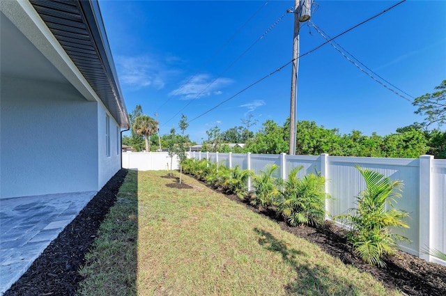 view of yard with a fenced backyard