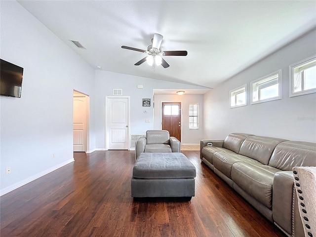 living area featuring a ceiling fan, vaulted ceiling, dark wood finished floors, and visible vents